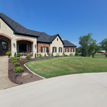 Estate Poolside Landscape & Hardscape Retreat with Custom Waterfeature