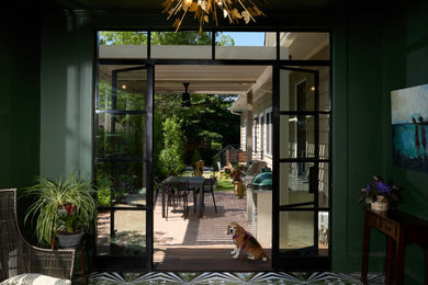 Inspiration for a small modern courtyard brick patio kitchen remodel in Atlanta with a pergola