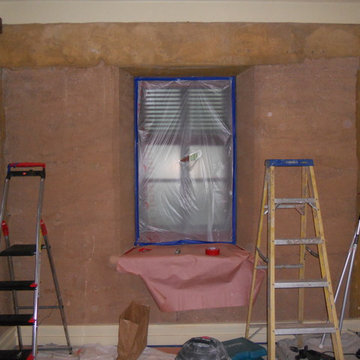 Adobe house dust control. Sheetrock level finish in bedroom.