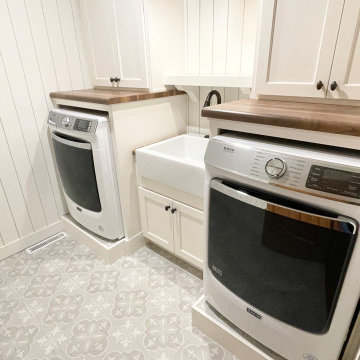 Laundry Room With Front Load Maytag, farmhouse sink, and AntiMicrobial Fan/Light