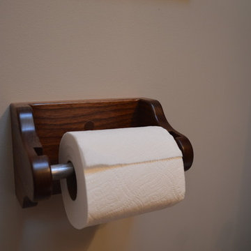 Arnold over the toilet cabinet in walnut with brushed steel door panels