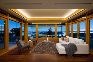 Example of a mid-sized trendy open concept dark wood floor living room design in Phoenix with white walls, no fireplace and no tv