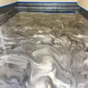 Grey pearl and black metallic epoxy garage floor