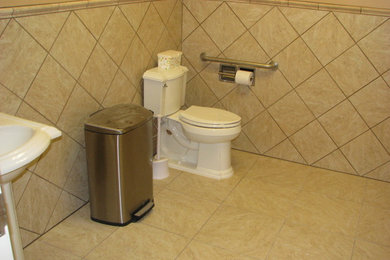 Mid-sized elegant 3/4 beige tile and ceramic tile ceramic tile bathroom photo in Wichita with a two-piece toilet, beige walls and a pedestal sink