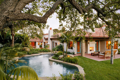Photo of a pool in Santa Barbara with brick pavers.