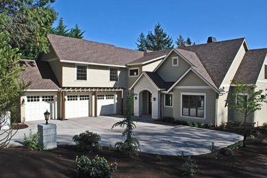 Large contemporary gray two-story concrete fiberboard exterior home idea in Portland with a shingle roof
