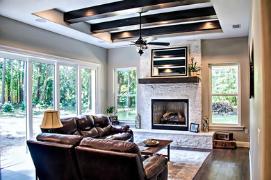 Tuscan family room photo in Denver with gray walls