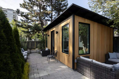 Large modern exterior in Toronto with wood siding.