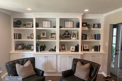 Large minimalist laminate floor and gray floor family room photo in Philadelphia with green walls