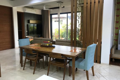 Inspiration for a modern dining room in Ahmedabad.