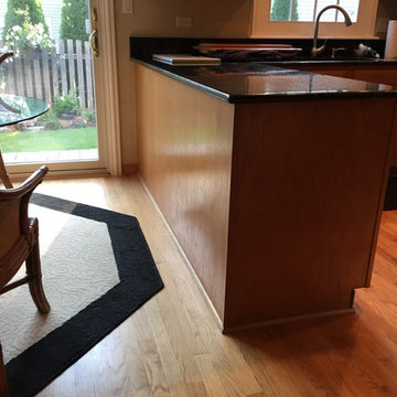 Oak cabinets grain filled and painted white with finish coats.