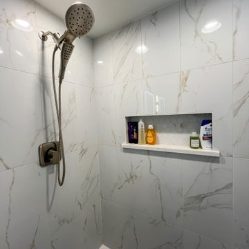 Primary Suite Remodel with Blue Cabinetry and Calacatta Miraggio Duo Quartz