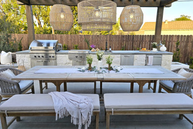 Patio kitchen - mid-sized contemporary backyard patio kitchen idea in Orange County