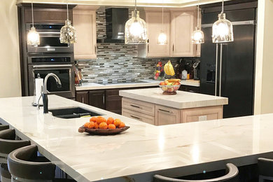 Example of a minimalist l-shaped open concept kitchen design in Jacksonville with beige cabinets, granite countertops, gray backsplash and an island