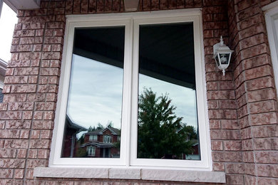 Example of a classic red brick house exterior design in Toronto