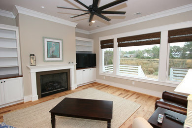 Living room - mid-sized traditional formal and open concept light wood floor living room idea in Other with beige walls, a standard fireplace, a metal fireplace and a tv stand