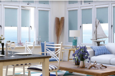 This is an example of a beach style sunroom in Other.
