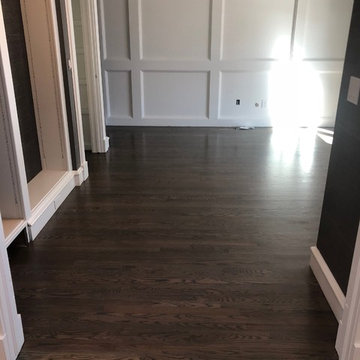 Red oak - 2 1/4" stained with custom grey stain and finished with waterbase