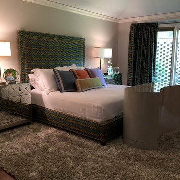 Curvy modern foot of bed TV lift cabinet