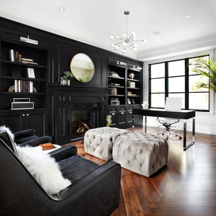 Design ideas for a transitional home office in Toronto with dark hardwood floors, a freestanding desk, black walls and brown floor.