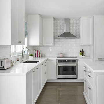 White Shaker Kitchen with Layered Backsplash