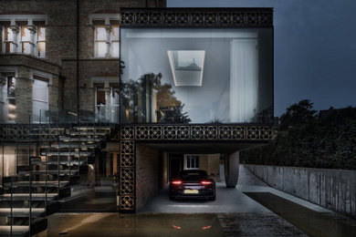Expansive and yellow contemporary brick house exterior with three floors and a pitched roof.