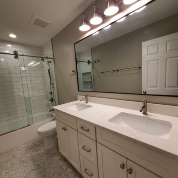 Bathroom remodeled With Double Sink, Standing Shower, Door Mirror & Flushing Toi