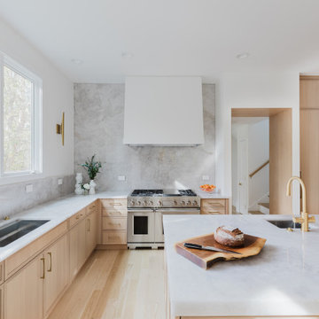 Glencoe Light-Filled Minimalist Kitchen With Slab Backsplash and Integrated Desi
