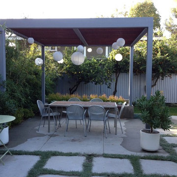 Mid century modern patio with concrete bench