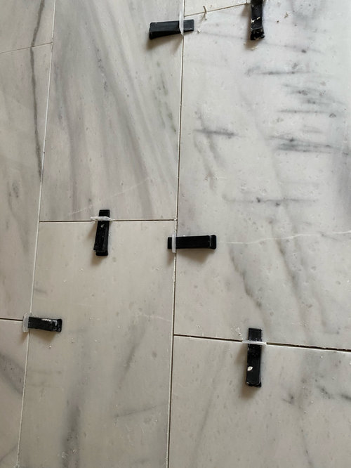 white veins or cracks on marble tile?