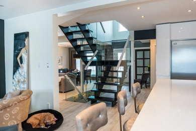 Staircase - mid-sized contemporary wooden u-shaped open and glass railing staircase idea in Other
