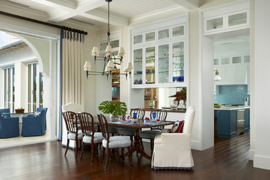 Great room - huge tropical dark wood floor great room idea in Miami with beige walls and no fireplace