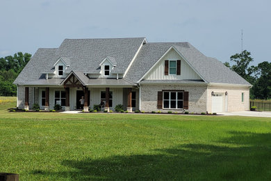 Example of a farmhouse exterior home design in Birmingham
