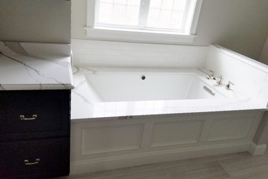 Bathroom - large transitional master porcelain tile and beige floor bathroom idea in Boston with dark wood cabinets and an undermount tub