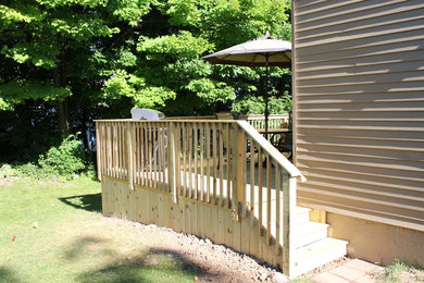 Small transitional backyard deck photo in Detroit with no cover