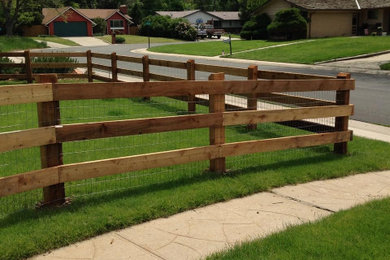 Photo of a rustic wood fence landscaping in Denver.