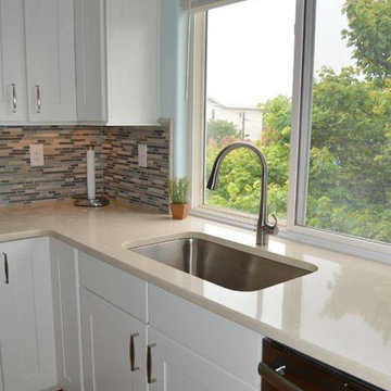 Kitchen Remodel with Maple White Cabinetry, Espresso Island and Tigris Sand Tops
