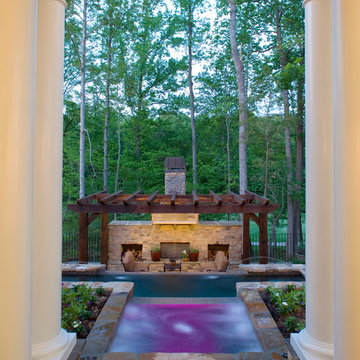 Backyard with Infinity Pool and Traditional White Pillars