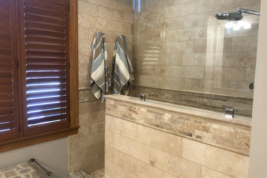 Inspiration for a large timeless master travertine tile and beige tile travertine floor and beige floor bathroom remodel in Minneapolis with gray walls, raised-panel cabinets, white cabinets, a one-piece toilet, an undermount sink and granite countertops
