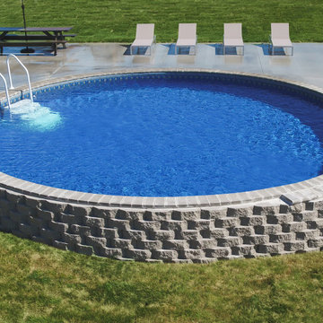 Stealth semi-inground vinyl liner pool w/stacked landscape stone