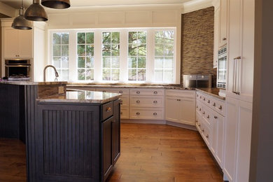 Huge transitional l-shaped kitchen photo in Columbus with recessed-panel cabinets, white cabinets, granite countertops, multicolored backsplash, porcelain backsplash, stainless steel appliances and an island