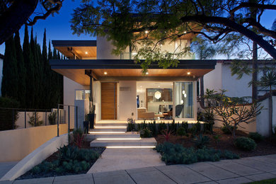 Contemporary white two-story stucco exterior home idea