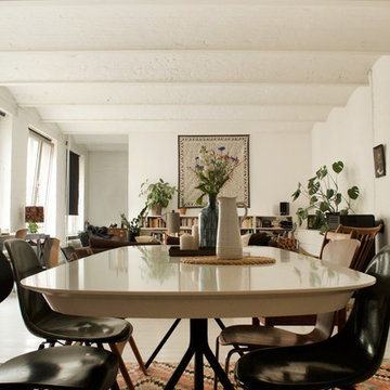 Kilm rug and vintage chairs in an open plan dinning room