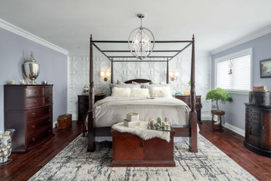Inspiration for a traditional guest bedroom in Toronto with grey walls, medium hardwood floors, no fireplace and brown floor.