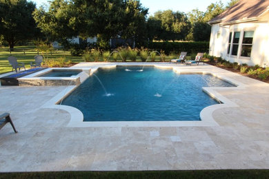 Large traditional swimming pool in Houston.