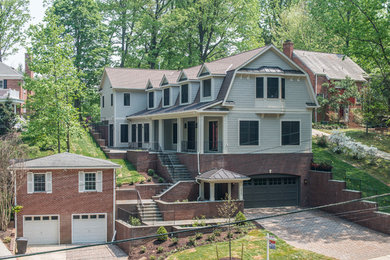 Large farmhouse gray three-story mixed siding exterior home photo in DC Metro