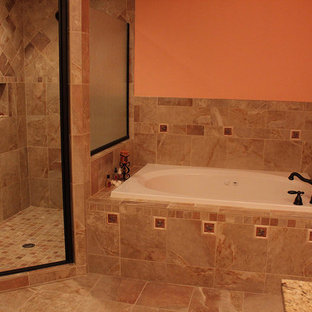 Master ceramic floor bathroom photo in DC Metro with orange walls