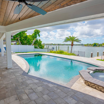 Waterfront Backyard Retreat Featuring Poolside Living and Modern Outdoor Design
