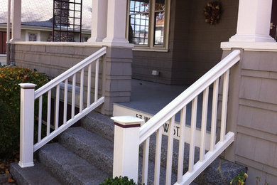 Small elegant concrete paver front porch photo in Boston