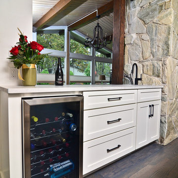 Opened half wall for beverage bar brings in more light